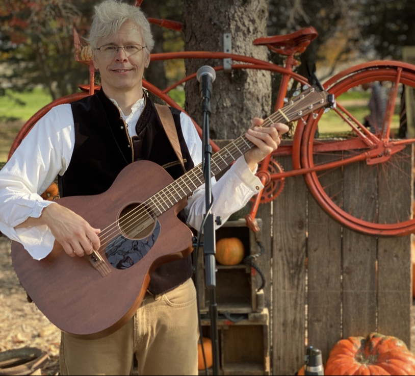 Musician Playing a Guitar